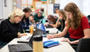 Computer science students at The Ellis School code together in class.